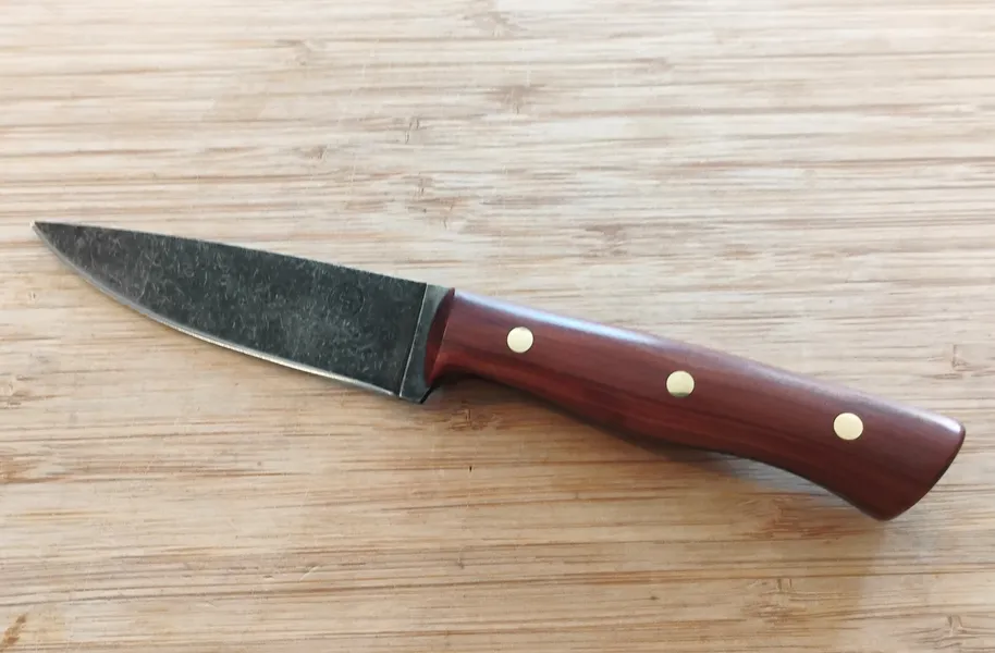 Left view of Red Cedar Bird and Trout #335 Knife, showcasing the Florida wood and brass pins