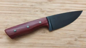 Custom camping knife with stabilized Florida Red Cedar handle and coffee-etched drop point blade, right side view