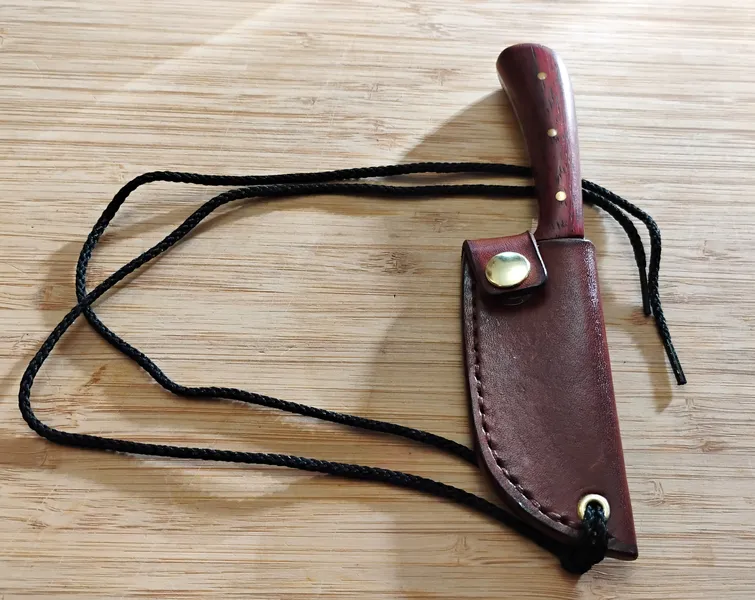 Neck knife in custom sheath with cord