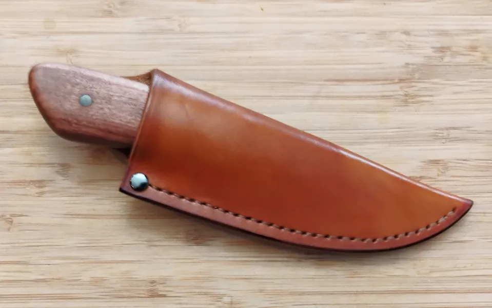Custom high carbon steel knife in pouch sheath with rivit at top corner