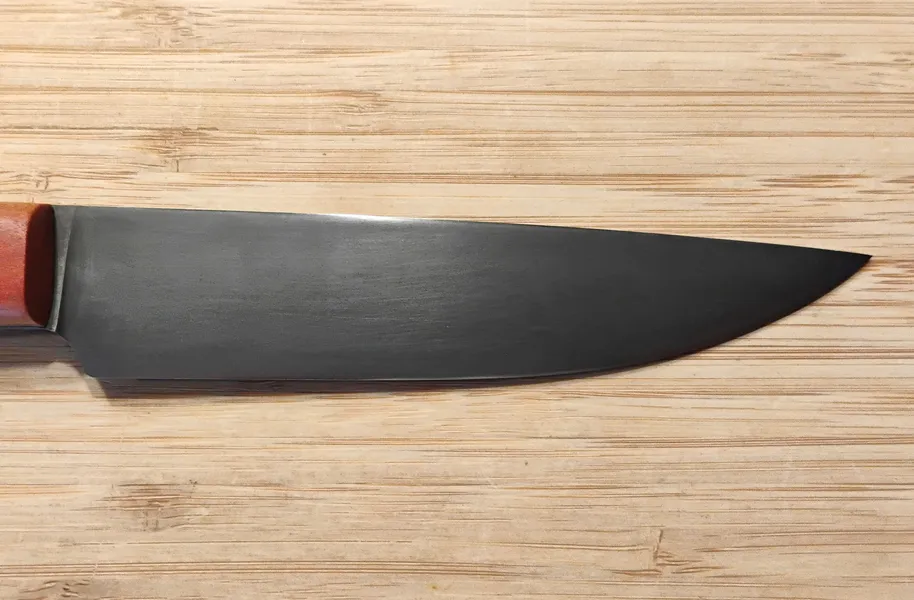 Closeup of Pernambuco Scalper Trade Knife #349 blade right side with antiqued 1095 high carbon steel finish.