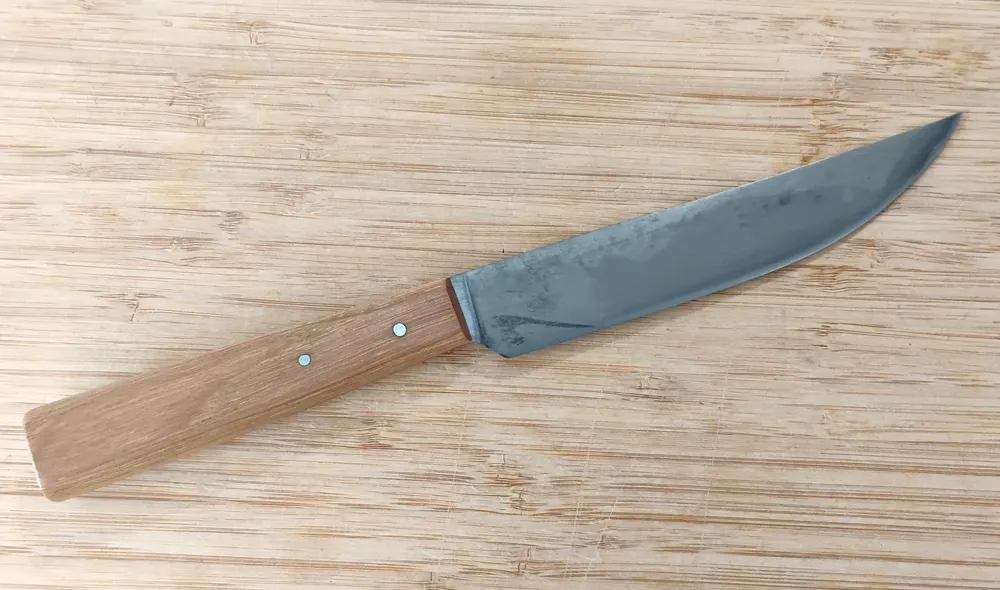 Right side view of Hard Maple Trade Knife #356, highlighting the antiqued blade and comfortable hard maple handle with steel pins.