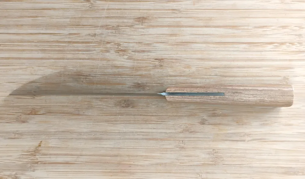 Belly view of Hard Maple Trade Knife #356, displaying the trailing point blade and ergonomic hard maple handle design.