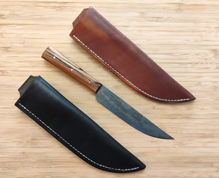 English Trade knife with pecan handle and two optional sheaths, one dyed with vinegaroon and one with Oak Bark dye
