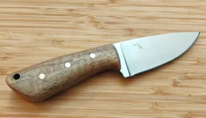 Handmade 3 Finger Skinner knife #394 with Pignut Hickory handle, brass pins, lanyard hole, and Florida etched logo.