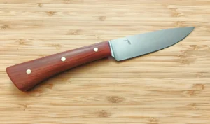 GreBec Paring/Utility kitchen knife in 1095 high carbon steel with stabilized Florida Red Cedar handle and engraved Florida logo on the blade.
