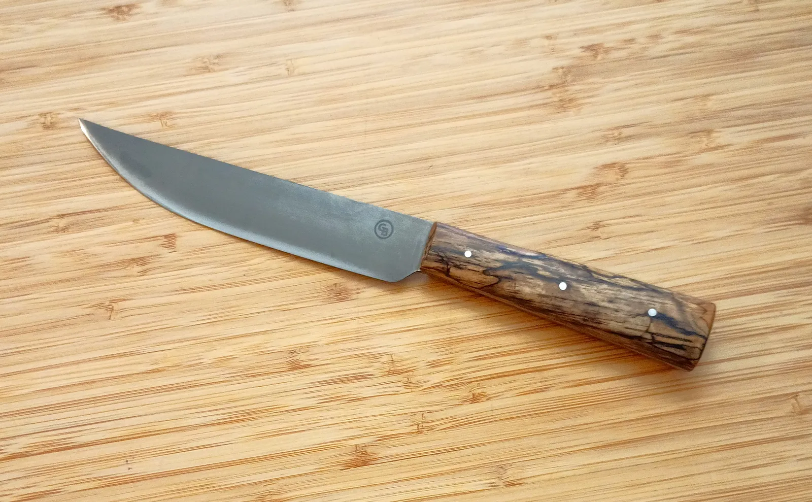 Full left-side view of handcrafted English trade knife with spalted pecan handle and antiqued high-carbon steel blade