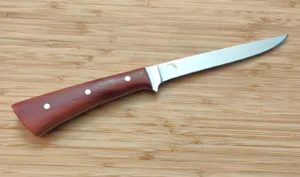 Right view of the Plateau Boning knife: made from 1095 high carbon steel and stabilized Red Cedar with the State of Florida logo.