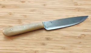 Handcrafted historic trade knife with stabilized Florida Magnolia wood handle and Florida logo on the antiqued high carbon steel blade.