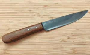 Small French Trade Knife – right side view with slight drop point carbon steel blade showing the Florida logo and stabilized Florida live oak handle.