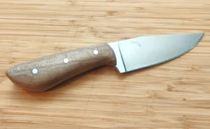Red Maple Goldilocks #446 - Right side view showing rich Florida Red Maple scales and Florida state etch on the clip point blade