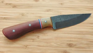 Handmade Florida Red Cedar Goldilocks Refined Grip #448 clip point hunting knife with stonewashed 1095 high carbon steel blade.