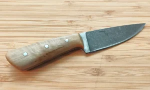 Right side view of Crepe Myrtle Neck Knife #452 displaying the full profile of the stonewashed blade and ergonomic stabilized wood handle.