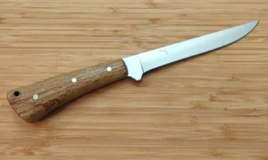 Discover the 7 Inch Bur Oak Fillet Knife, handcrafted with stabilized Florida Bur Oak and flexible 1095 high-carbon steel.