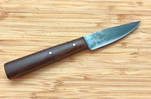 Left view of the Live Oak 1850s Tiny Trade knife showing the Live Oak grain, mild steel pins and an antiqued blade.